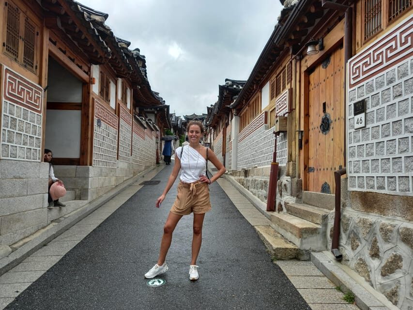 Layover tour to Gyeongbokgung-Folk Museum-Bukchon-Insadong - Bukchon Hanok Village: hanoks with Seoul skyline in view